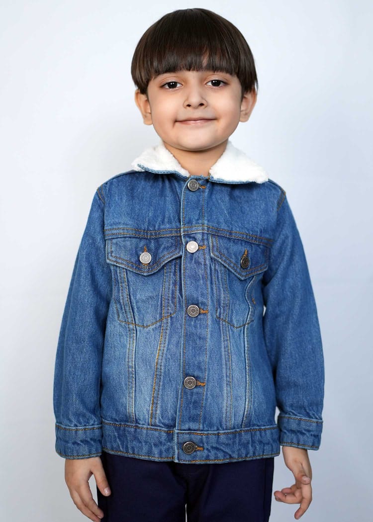 Playful child wearing a stylish mid blue denim jacket with a cozy white collar, perfect for kids' fashion.