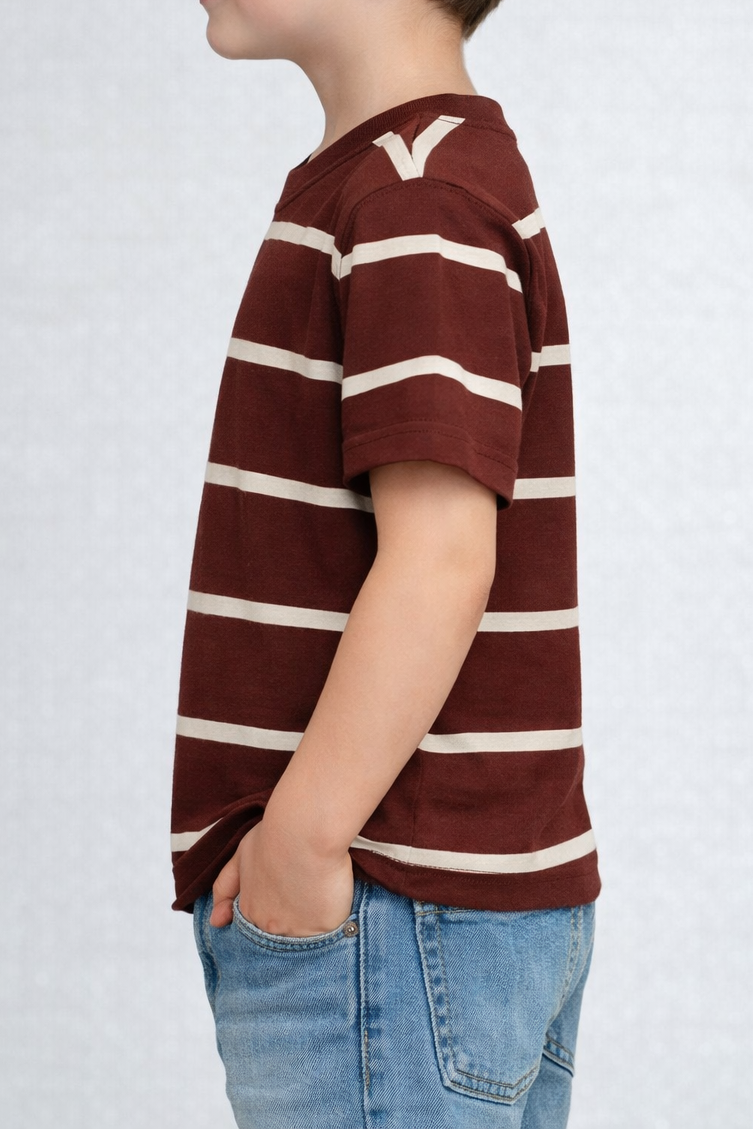 Child wearing a maroon and white striped shirt on a plain background